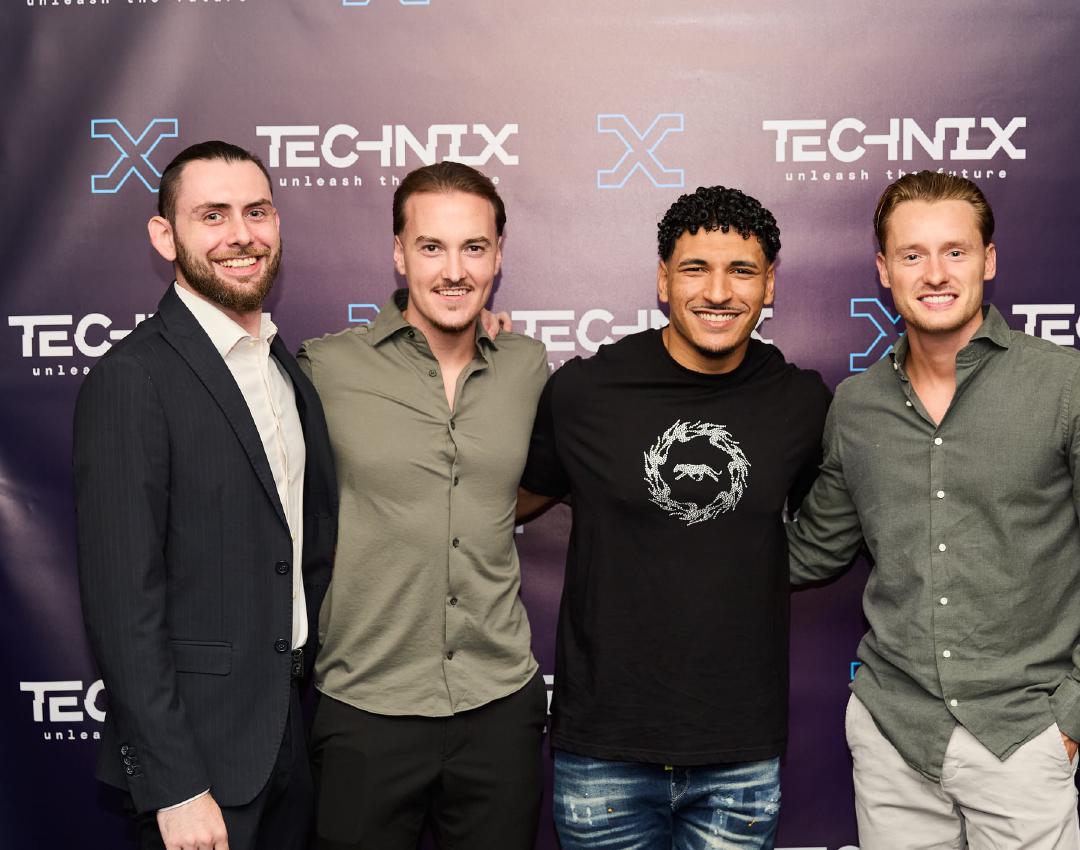 Four Technix colleagues at a Technix event